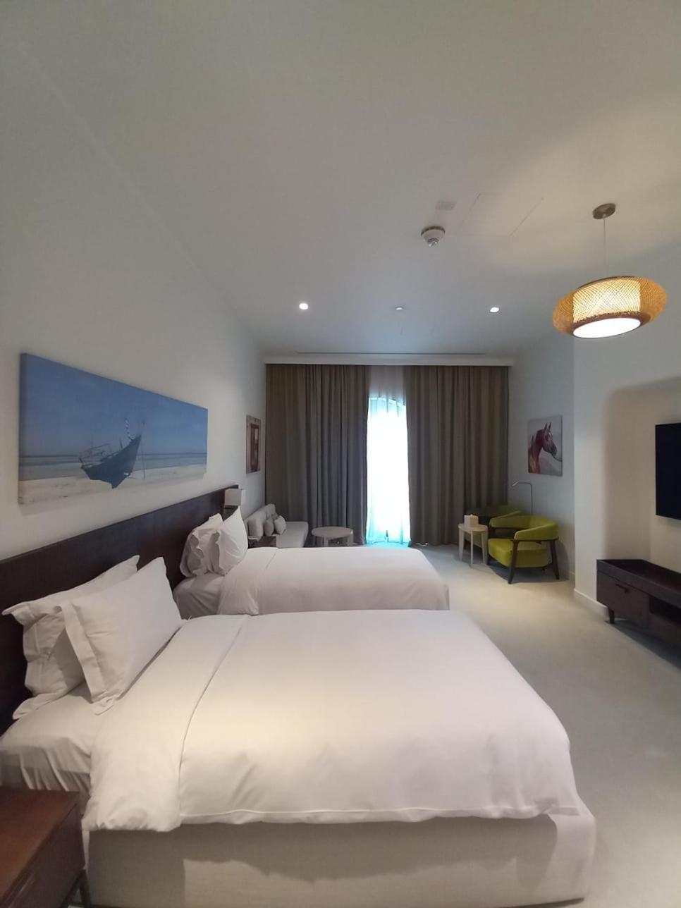 Mina Hotel And Residences By The Torch Доха Экстерьер фото A room at the hotel