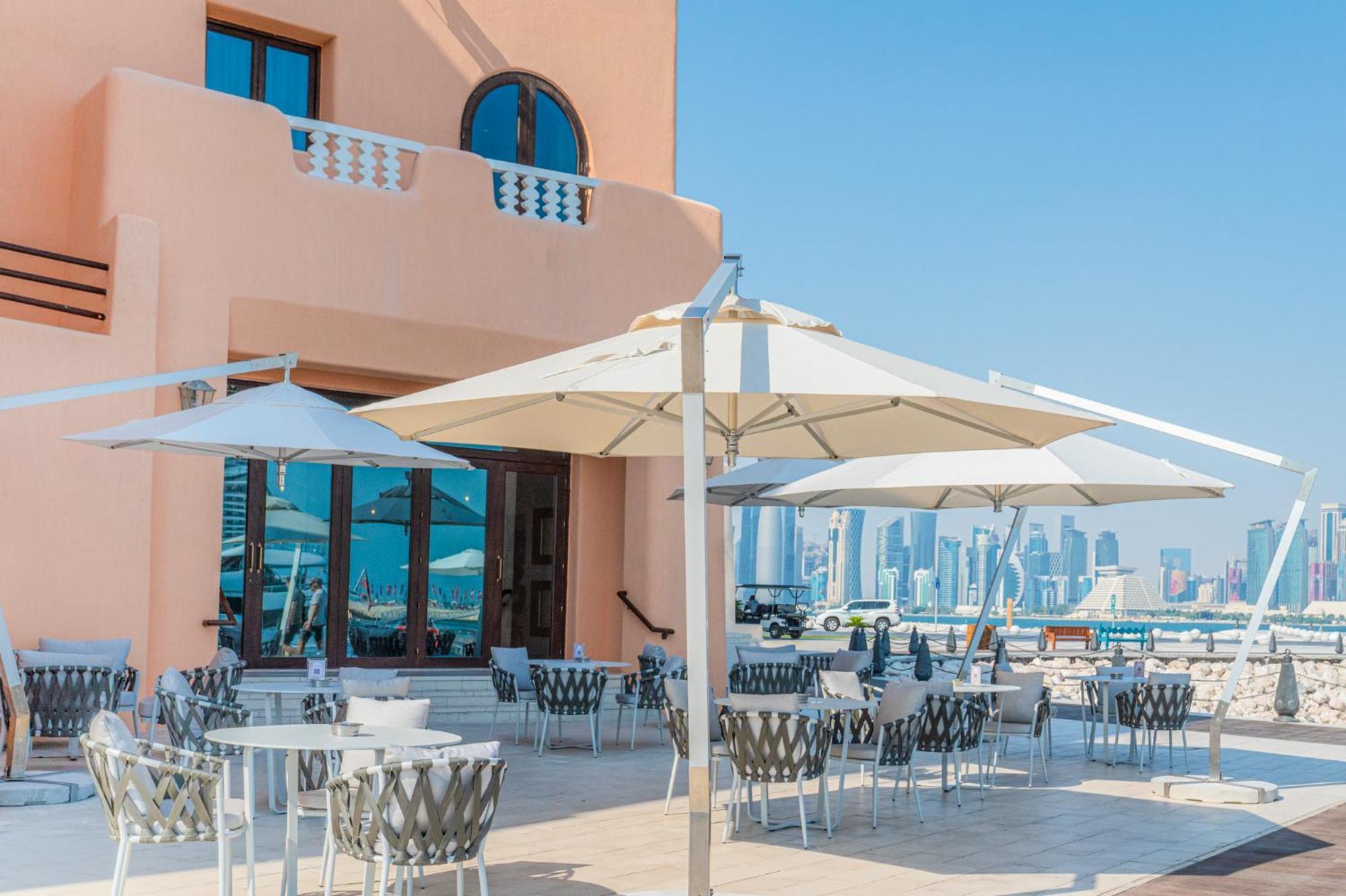Mina Hotel And Residences By The Torch Доха Экстерьер фото A patio umbrella