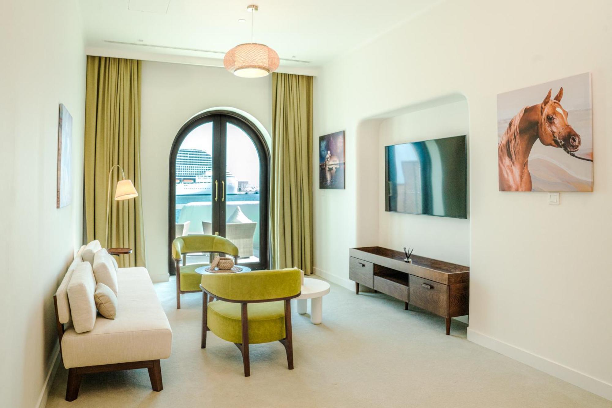 Mina Hotel And Residences By The Torch Доха Экстерьер фото A living room at the hotel