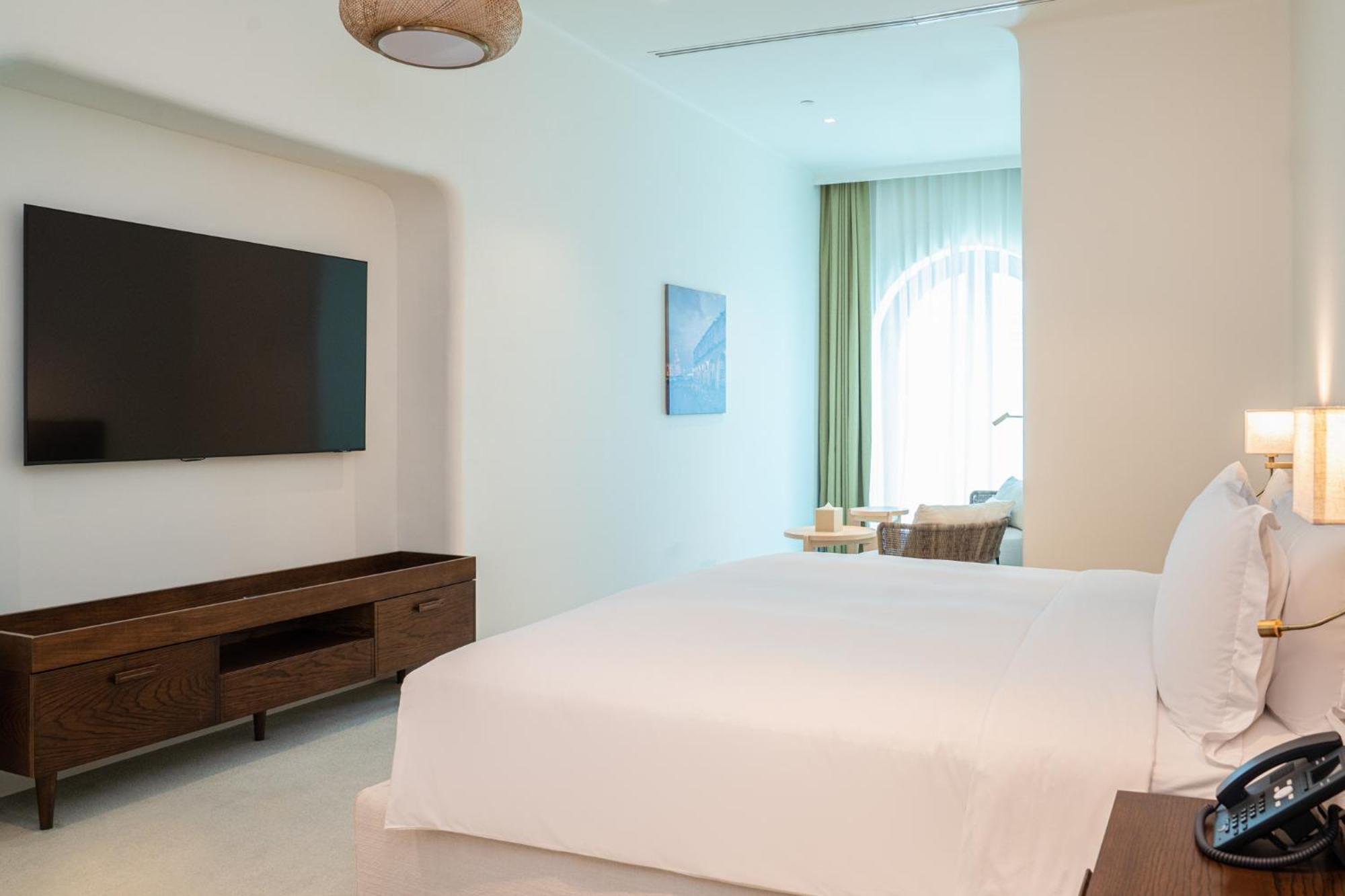 Mina Hotel And Residences By The Torch Доха Экстерьер фото A bedroom at the hotel